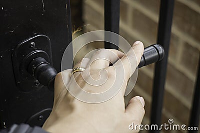Woman hand hold on opening door Stock Photo