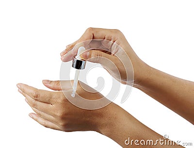 Dropper in woman hand isolated with clipping path Stock Photo