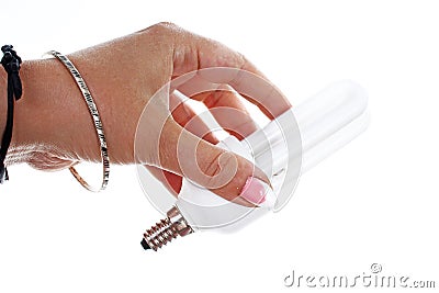 Woman hand holding Fluorescent, energy saving light bulb on isolated white cutout background. Studio photo with studio Stock Photo