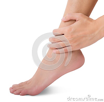 Woman hand holding her beautiful healthy foot and massaging ankle in pain area. Stock Photo