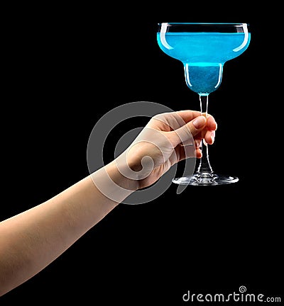 Woman hand holding margarita glass isolated on black. Stock Photo