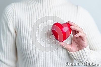 Woman hand holding red heart shape. love, donor, world heart day, world health day and Insurance concepts Stock Photo
