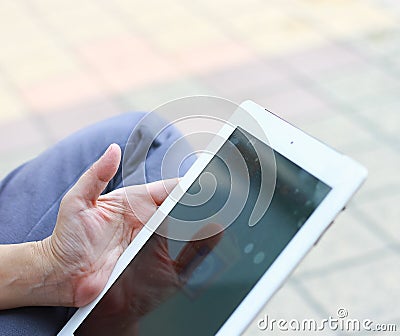 Woman hand on iPad Stock Photo