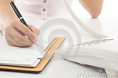 Woman hand making note Stock Photo