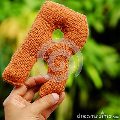 Woman hand pick knitted alphabet Stock Photo