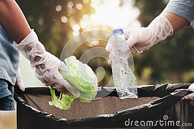 woman hand picking up garbage plastic for cleaning Stock Photo