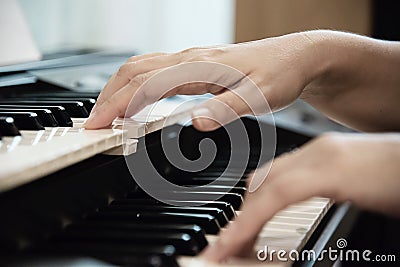 Woman hand play electone keyboard Stock Photo