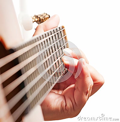 Woman hand playing guitar Stock Photo