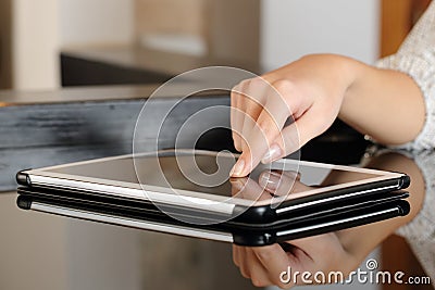 Woman hand pressing a tablet touch screen Stock Photo