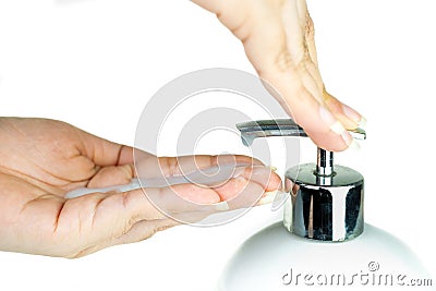 Woman hand pumping lotion from the bottle a whip liquid soap at white background, Lady using alcohol gel as hand sanitizer, Stock Photo