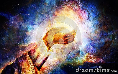 Woman hand with spiritual mystic light, painting collage. Cosmic space. Stock Photo