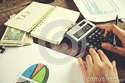 Woman hand tax text Stock Photo