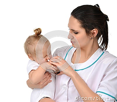 Woman hand using medicine nose spray nasal for baby toddler Stock Photo