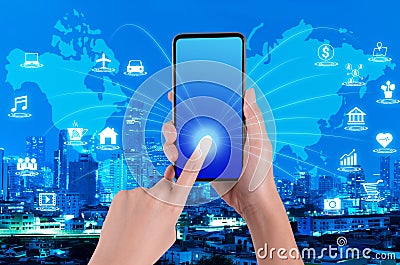 Woman hand using smartphone on internet of things and world map Stock Photo