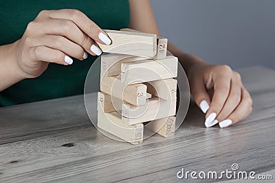 woman hand wooden cubes on tableÑŽ Stock Photo