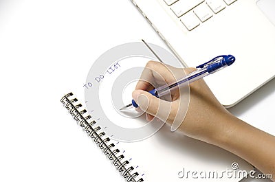 Woman hand writing with pen on notebook Stock Photo