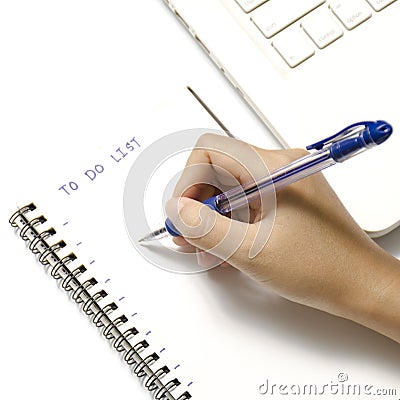 Woman hand writing with pen on notebook Stock Photo