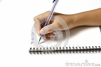 Woman hand writing with pen on notebook Stock Photo