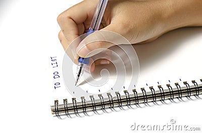 Woman hand writing with pen on notebook Stock Photo