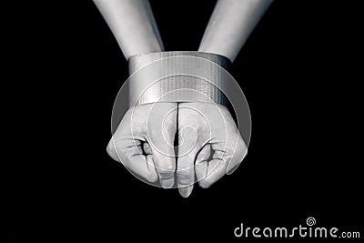 Woman's hands bound with tape Stock Photo