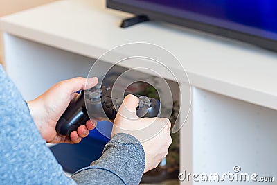Woman hands with a game controller, relaxation at home Stock Photo
