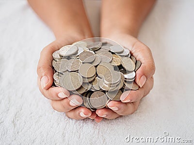 Woman hands holding coins on white background. saving money, fin Stock Photo