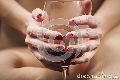 Woman hands holding a glass of wine Stock Photo