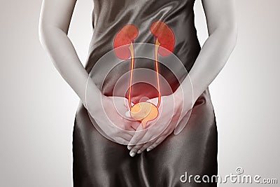 Woman with hands holding her crotch Stock Photo