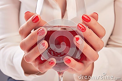 Woman hands holding large glass of wine. Stock Photo