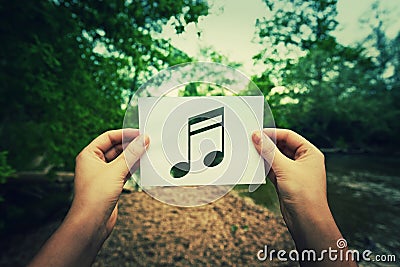 Holding music note Stock Photo