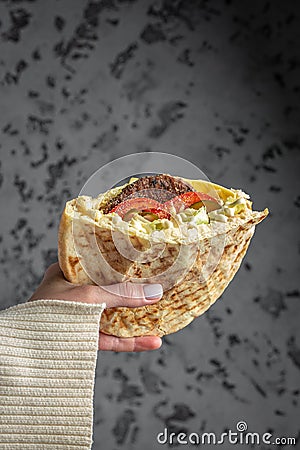 Woman hands holds doner kebab. Fast food take away. copy space Stock Photo