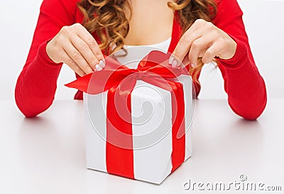 Woman hands opening gift boxes Stock Photo