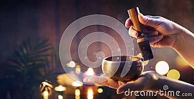 Woman Hands Playing Tibetan Singing Bowl Stock Photo