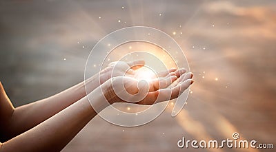 Woman hands praying for on sunset background Stock Photo