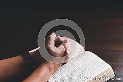 Woman hands praying to god with the bible. Woman pray for god blessing to wishing have a better life. begging for forgiveness and Stock Photo