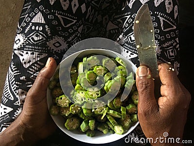 Woman hands slicing Okra Stock Photo