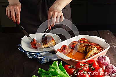 Woman hands slicing up tasty roasted grilled chicken Stock Photo