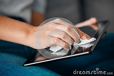 Woman hands, tablet and cleaning screen for dust, dirt risk and bacteria safety in home. Female, girl and device Stock Photo