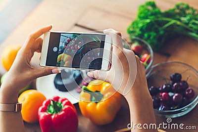 Woman hands taking photo fruit with smartphone, lifestyle concept. Stock Photo