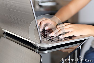 Woman hands typing in a laptop working at home Stock Photo