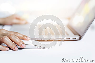 Woman hands using mouse with laptop keyboard Stock Photo
