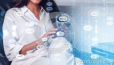 Woman hands using smartphone, ICO icons, cryptocurrency digital hologram Stock Photo