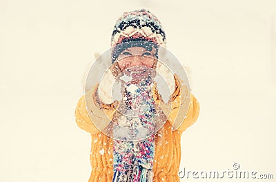 Woman Hands wearing gloves shaking snow outdoor Stock Photo