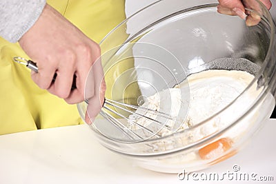 Woman whisking batter Stock Photo