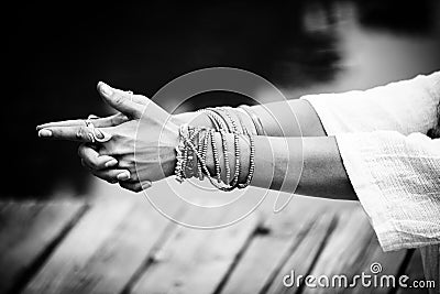 Woman hands in yoga symbolic gesture mudra bw Stock Photo