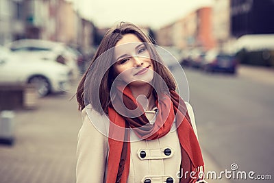 Woman happ smiling outdoors in city Stock Photo