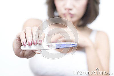 A woman happy to know that pregnant after using the pregnancy test. Stock Photo