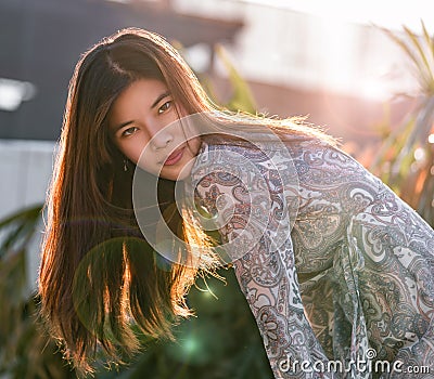 Woman with hard sunflare on with construction site on the background for developing city woman cocnept Stock Photo