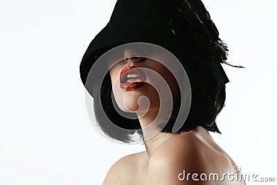 Woman in a hat and a wig Stock Photo