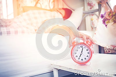 woman hates waking up early in the morning. Sleepy girl Touch at Stock Photo